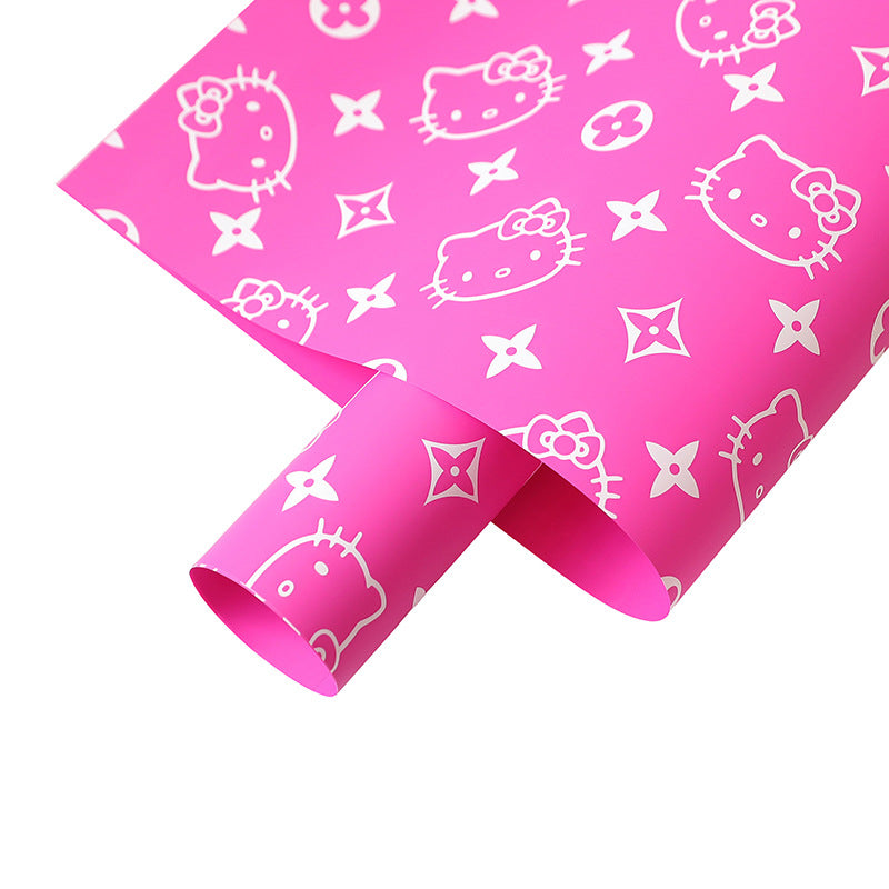 Kitty Cat nestled in vibrant flower wraps, perfect for decorative pet-themed floral arrangements and gifts.