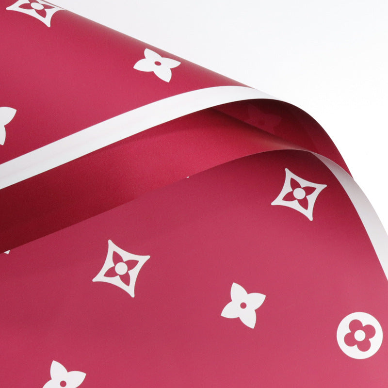 Valentine's floral paper pack featuring elegant red roses and romantic designs, perfect for crafting love-themed projects.