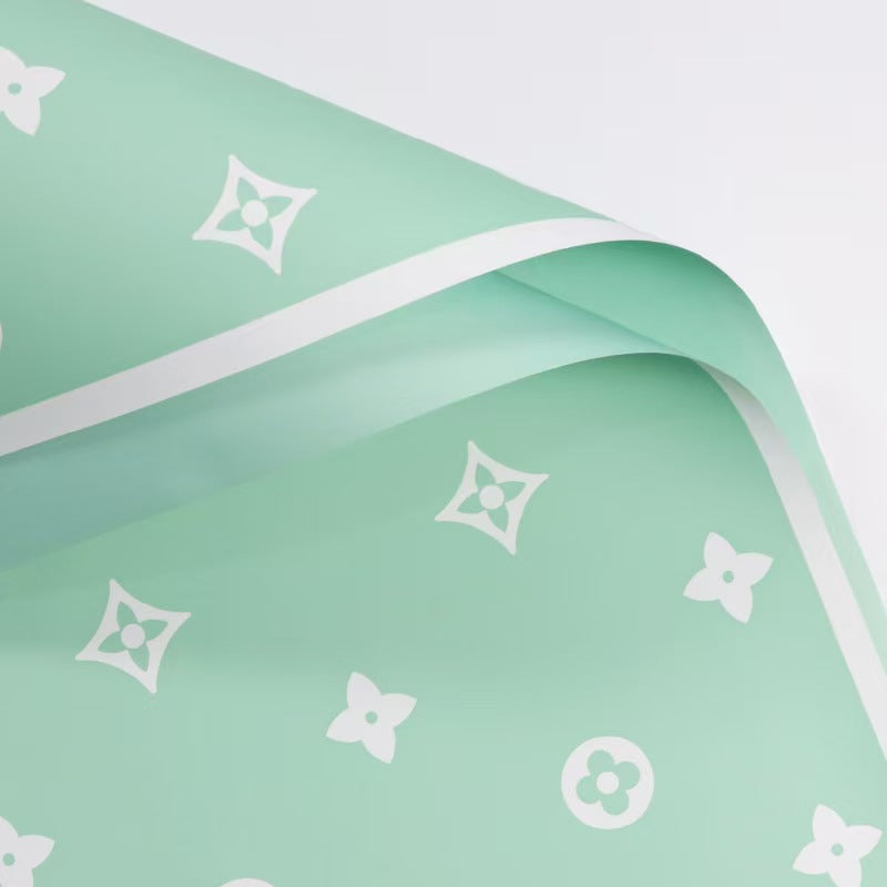 Valentine's floral paper pack featuring elegant red roses and romantic designs, perfect for crafting love-themed projects.