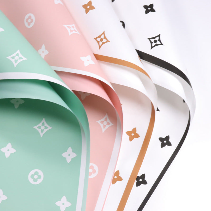 Valentine's floral paper pack featuring elegant red roses and romantic designs, perfect for crafting love-themed projects.