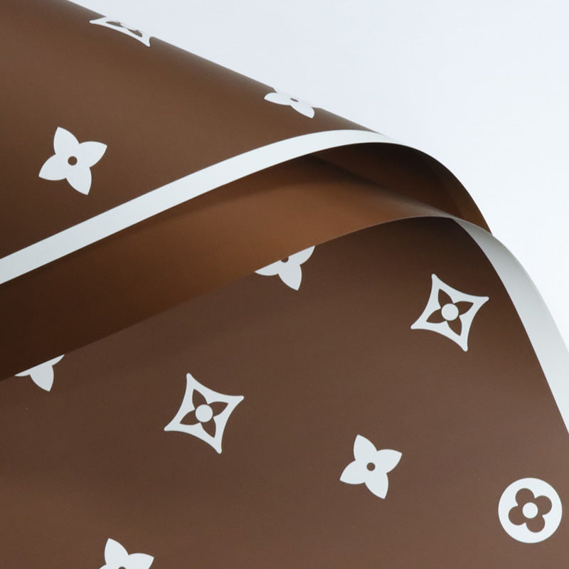 Valentine's floral paper pack featuring elegant red roses and romantic designs, perfect for crafting love-themed projects.