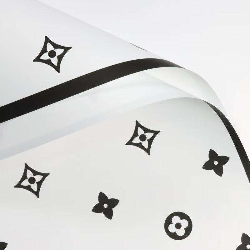 Valentine's floral paper pack featuring elegant red roses and romantic designs, perfect for crafting love-themed projects.