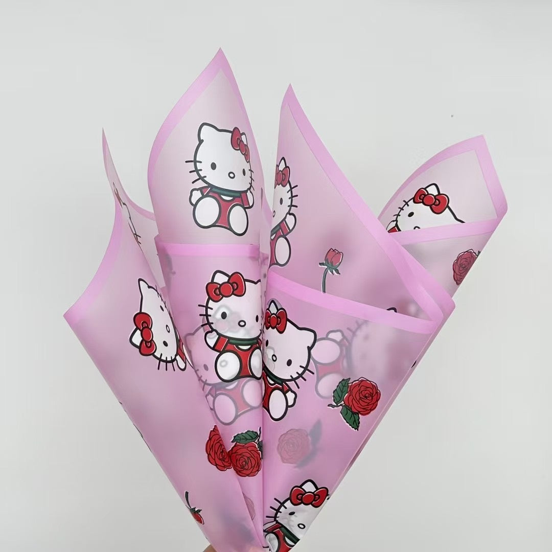 Elegant pink rose bouquet with Hello Kitty figurine, perfect for gifting and floral arrangements featuring characters.