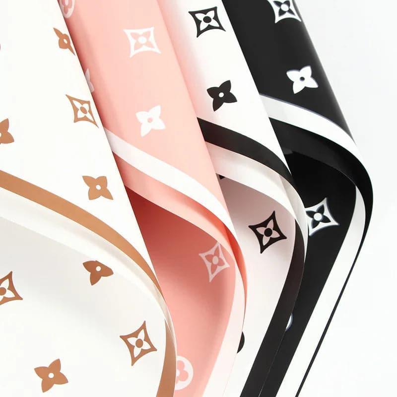 Valentine's floral paper pack featuring elegant red roses and romantic designs, perfect for crafting love-themed projects.